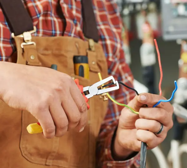 electrician at wiring work
